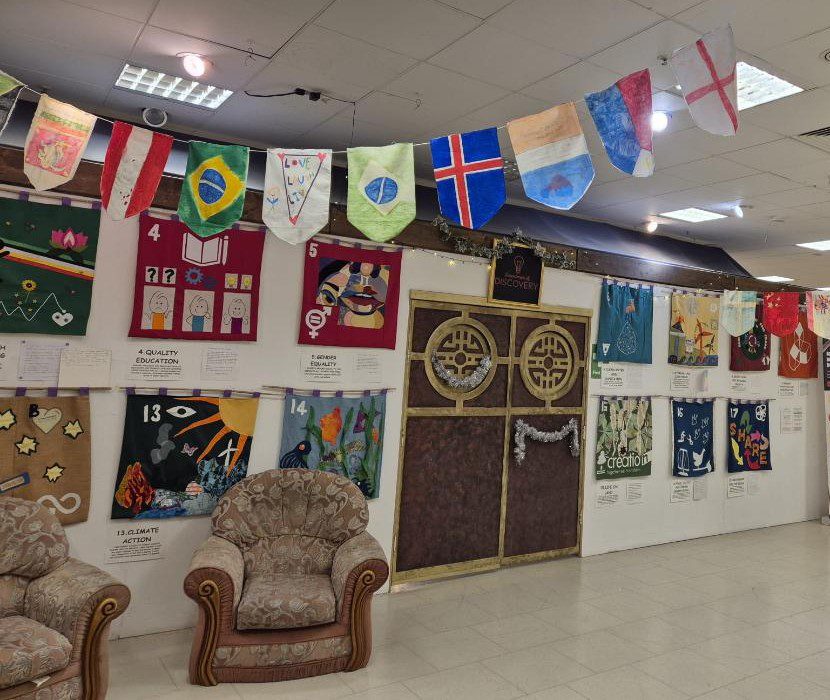 A large room decorated with colourful flags