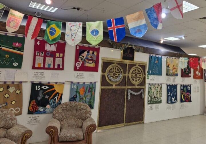 A large room decorated with colourful flags